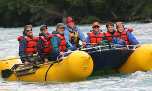 Family group enjoying a float raft trip on the Kenai River